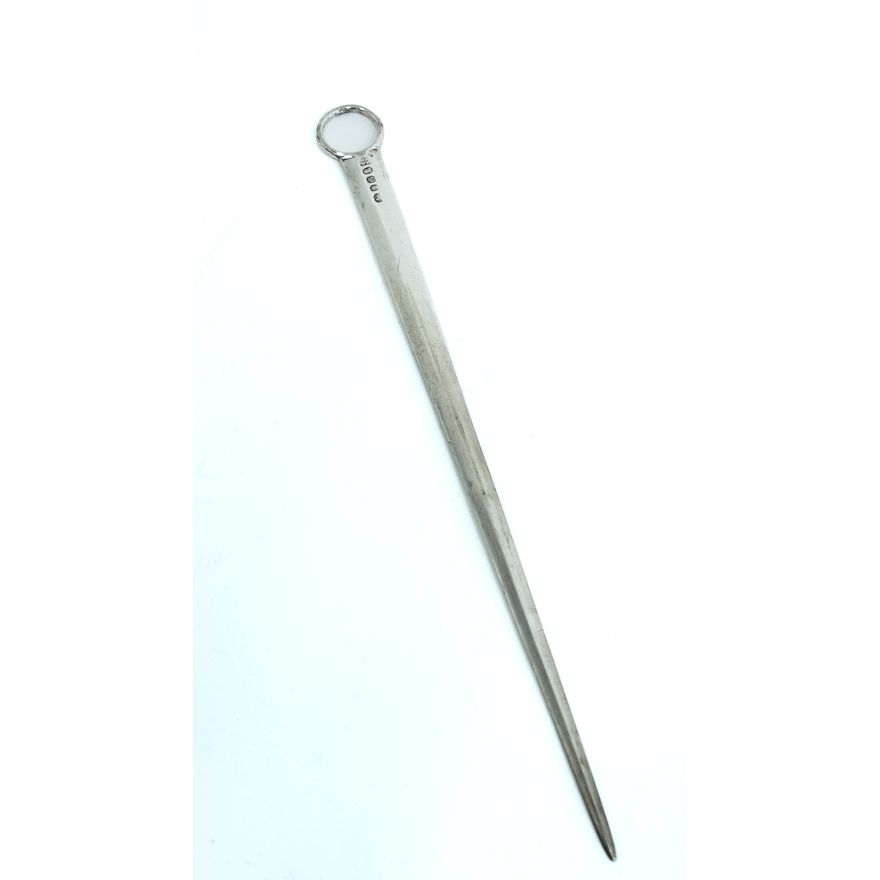 A silver meat skewer