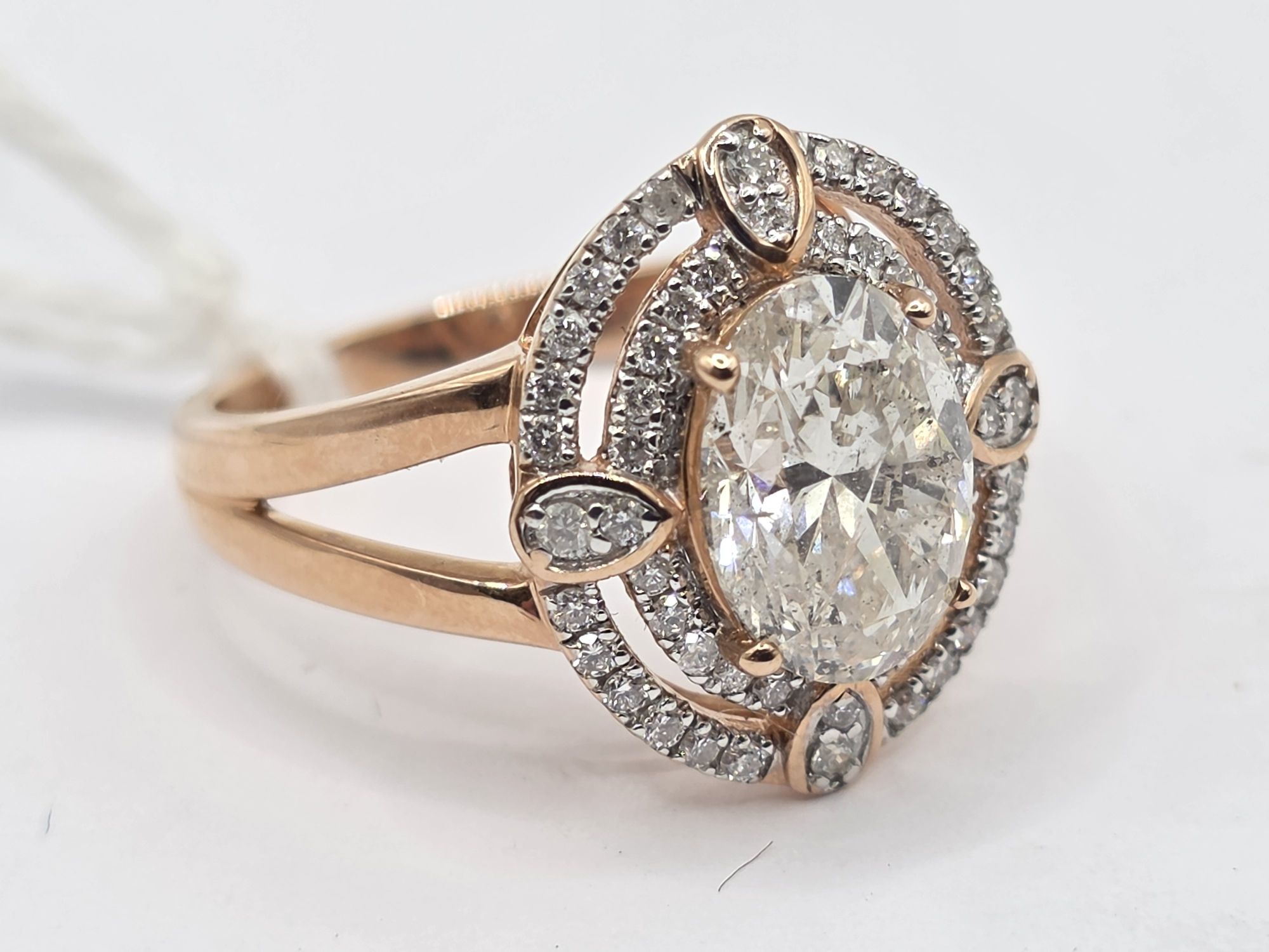 257 · 14K GOLD DIAMOND HALO RING