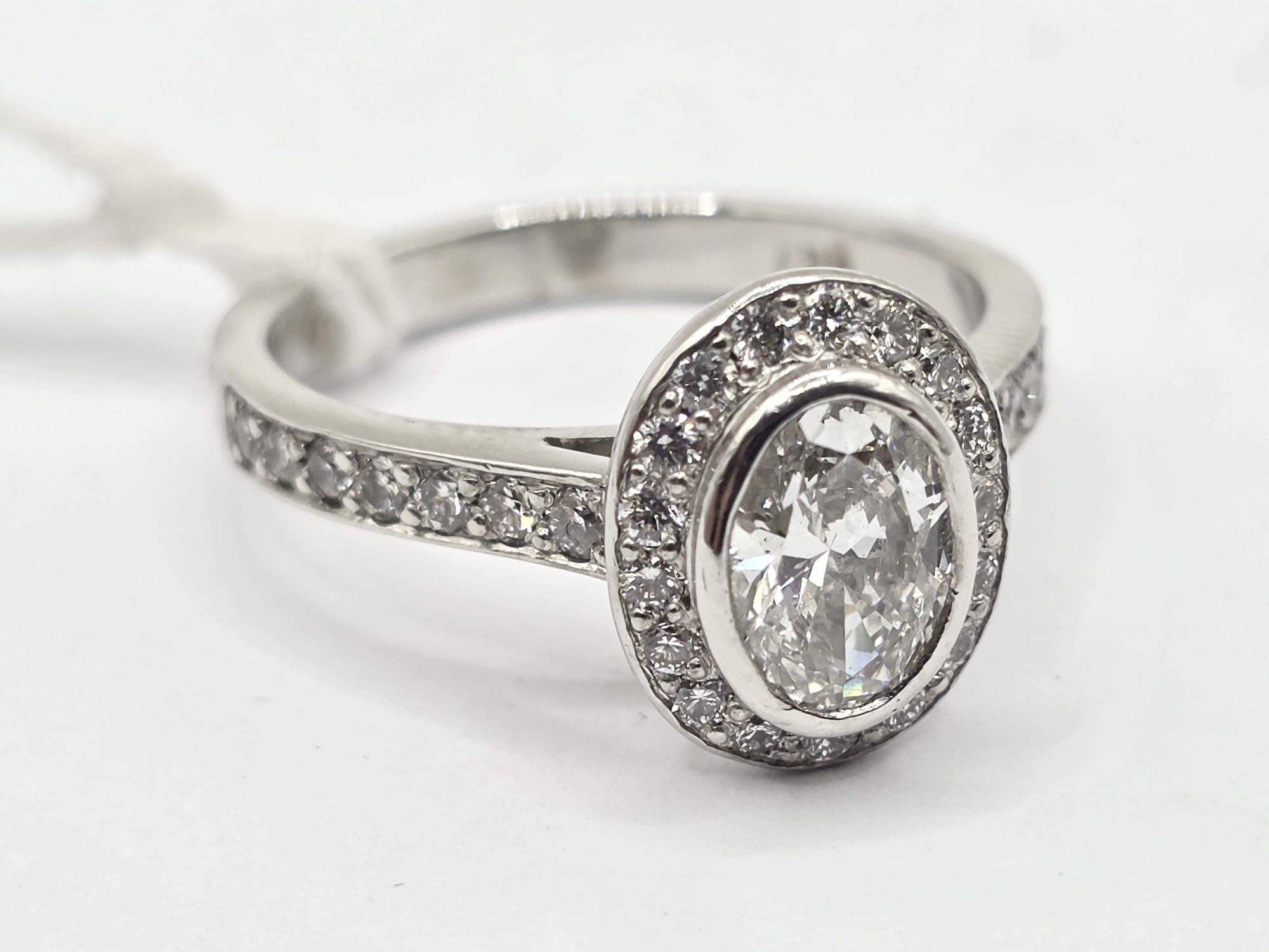 306 · 18CT WHITE GOLD DIAMOND HALO RING
