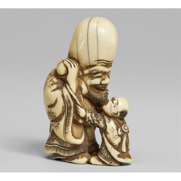 An ivory netsuke of Fukurokuju and karako. Early 19th century
