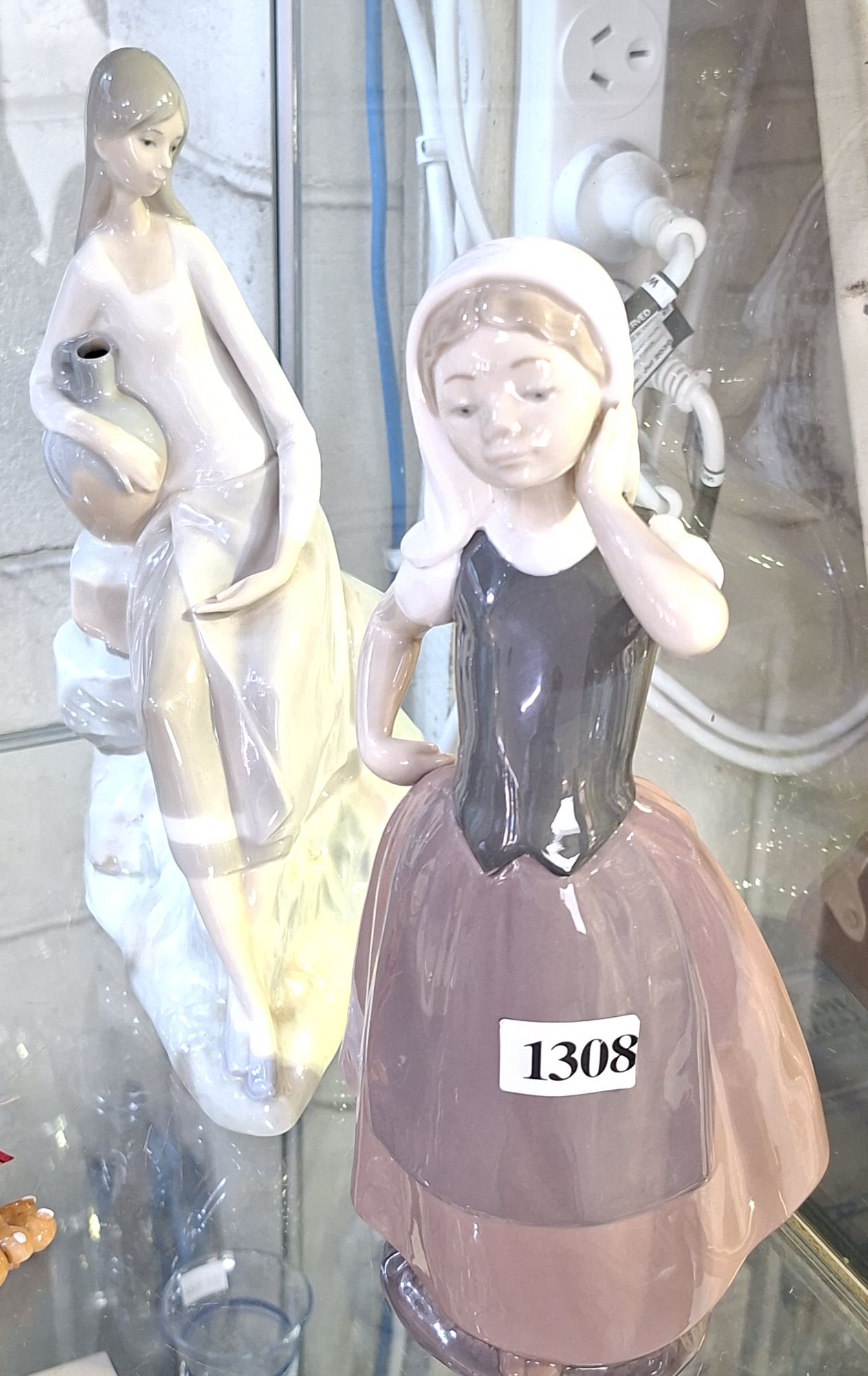 1308 · TWO NAO FIGURINES