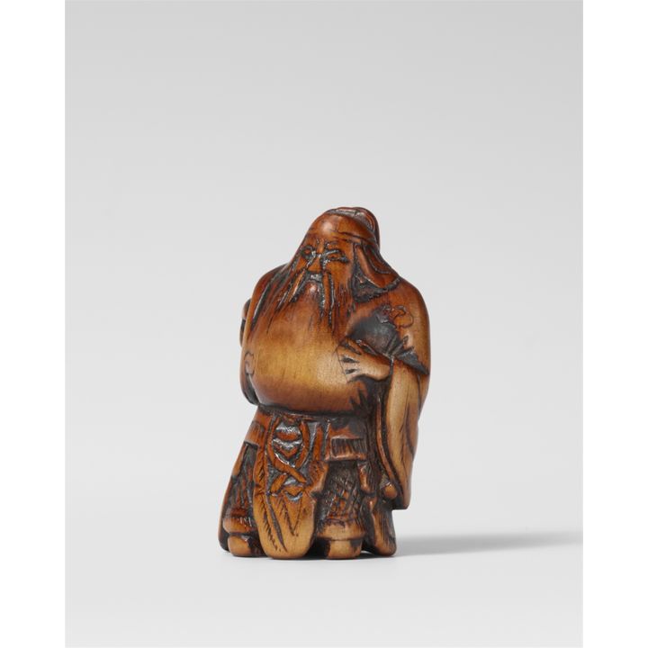 A boxwood netsuke of Kan’u. Early 19th century