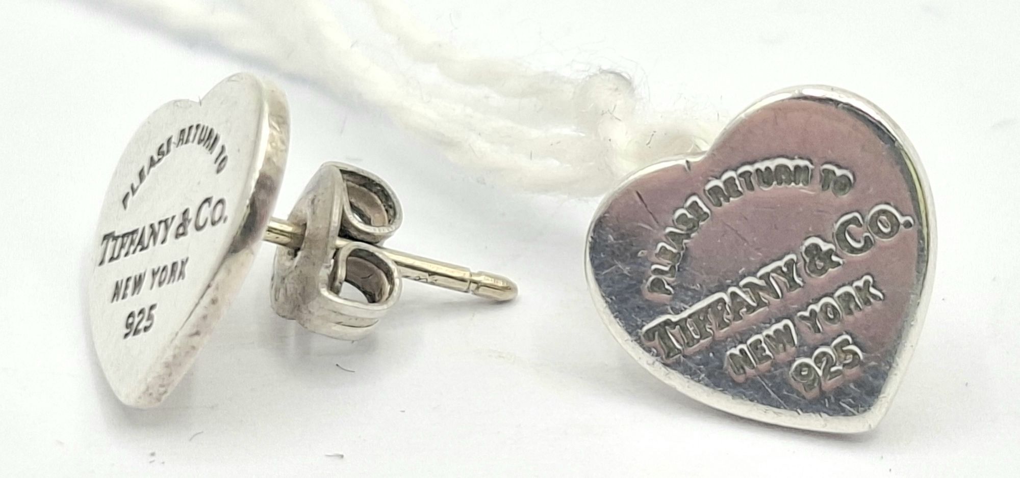 1107 · A PAIR OF STERLING SILVER STUD EARRINGS