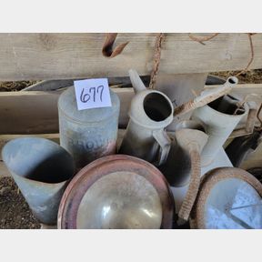 Assortment of Galvanized Oil Cans and Chicken Feed Top