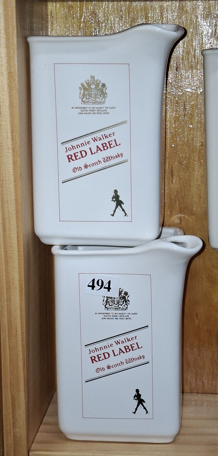 A PAIR OF ELISCHER JOHNNIE WALKER JUGS