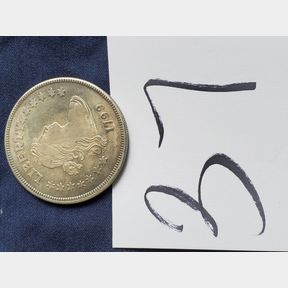 1799 Liberty round metal thing - NOT A REAL COIN pretty sure.