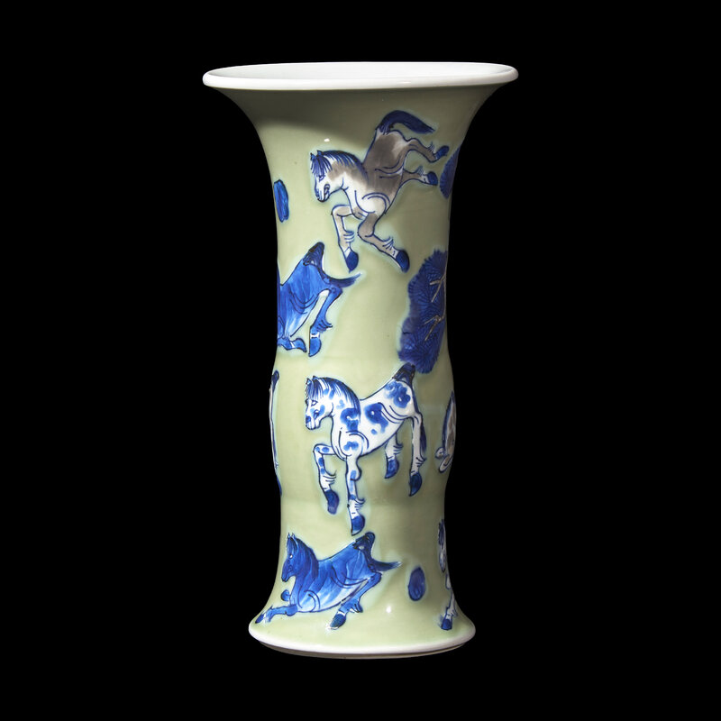 A Chinese Celadon Ground Copper Red, Blue and White 'Horses' Gu Vase, Kangxi Period
清康熙 豆青地青花釉裏紅八駿圖觚
