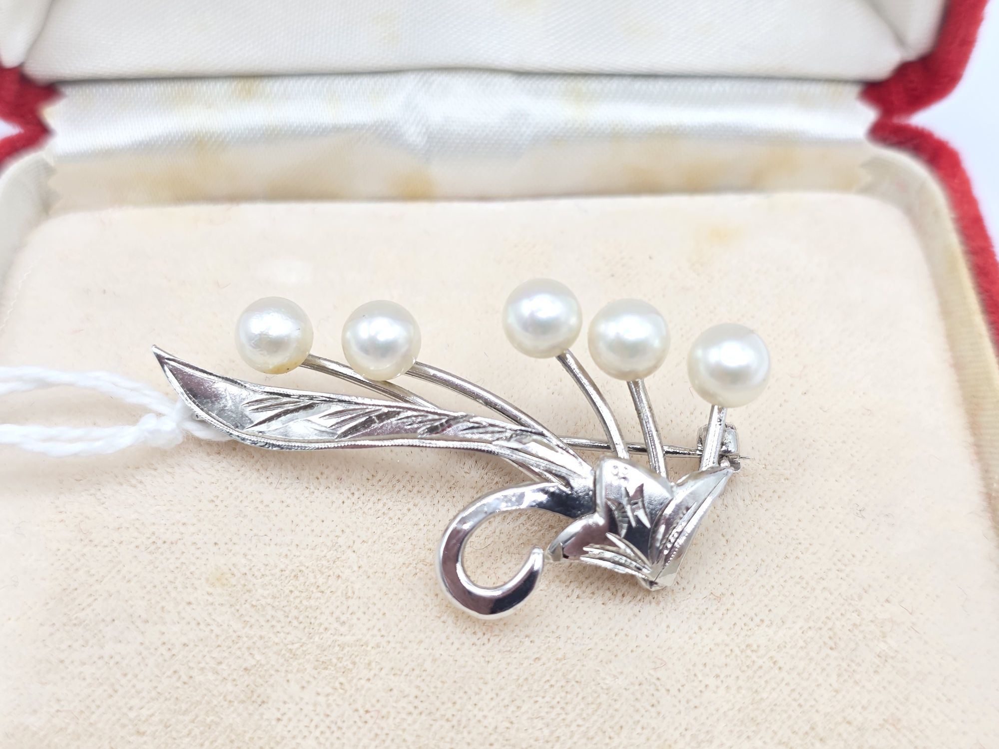 65 · SILVER AND PEARL BROOCH