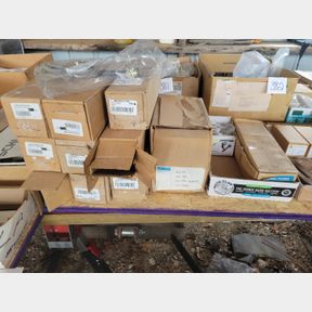 3 Stacks of new hose kits, wall bumpers, and door closures