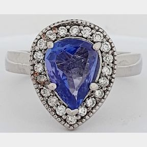 1,043CT PEAR SHAPPED TANZANITE & 0,200CT DIAMONDS IN 18CT WHITE GOLD RING - 51929/048