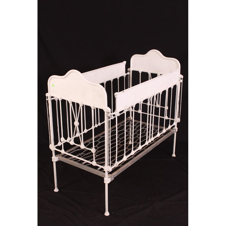 Antique cast store iron baby crib