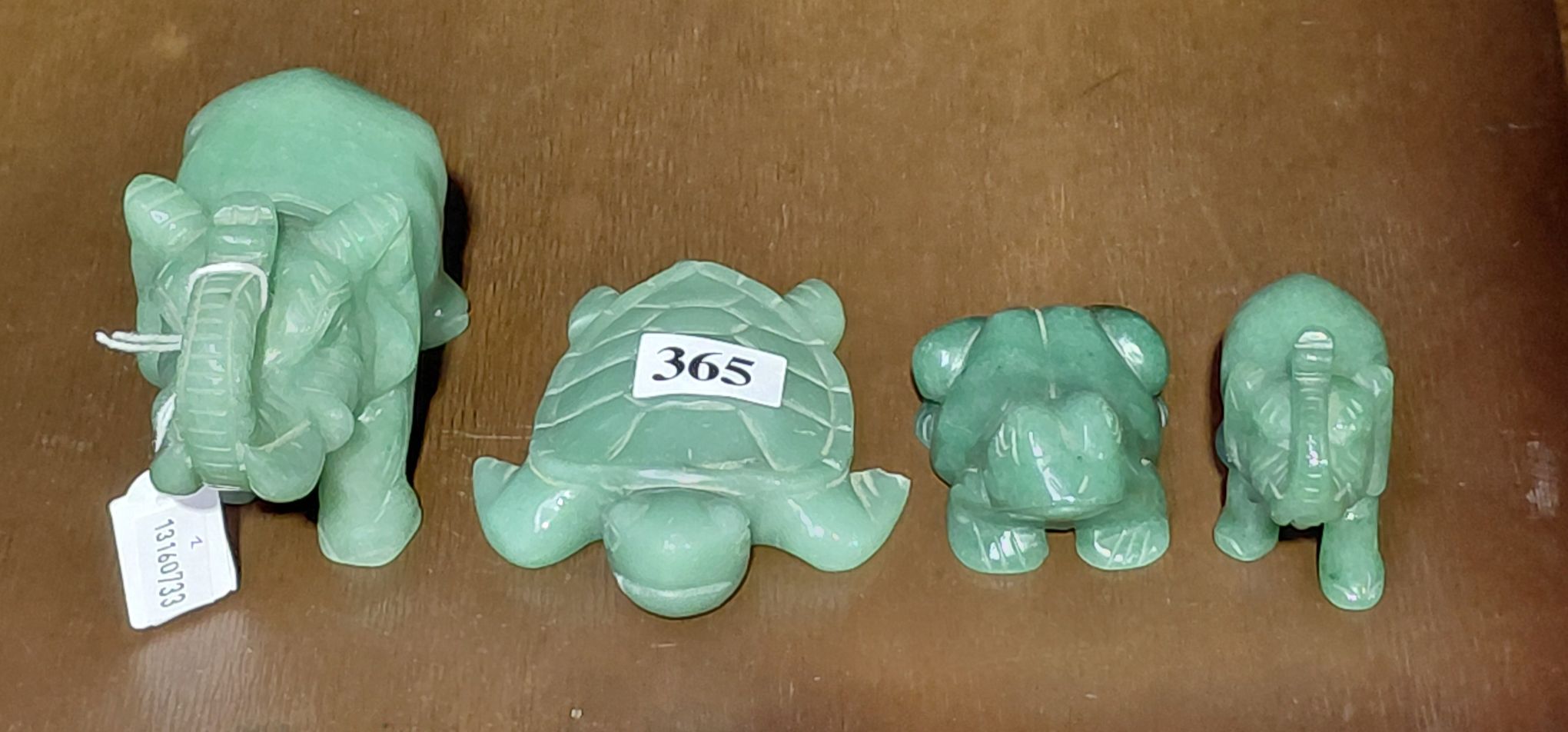TWO CARVED JADE ELEPHANTS