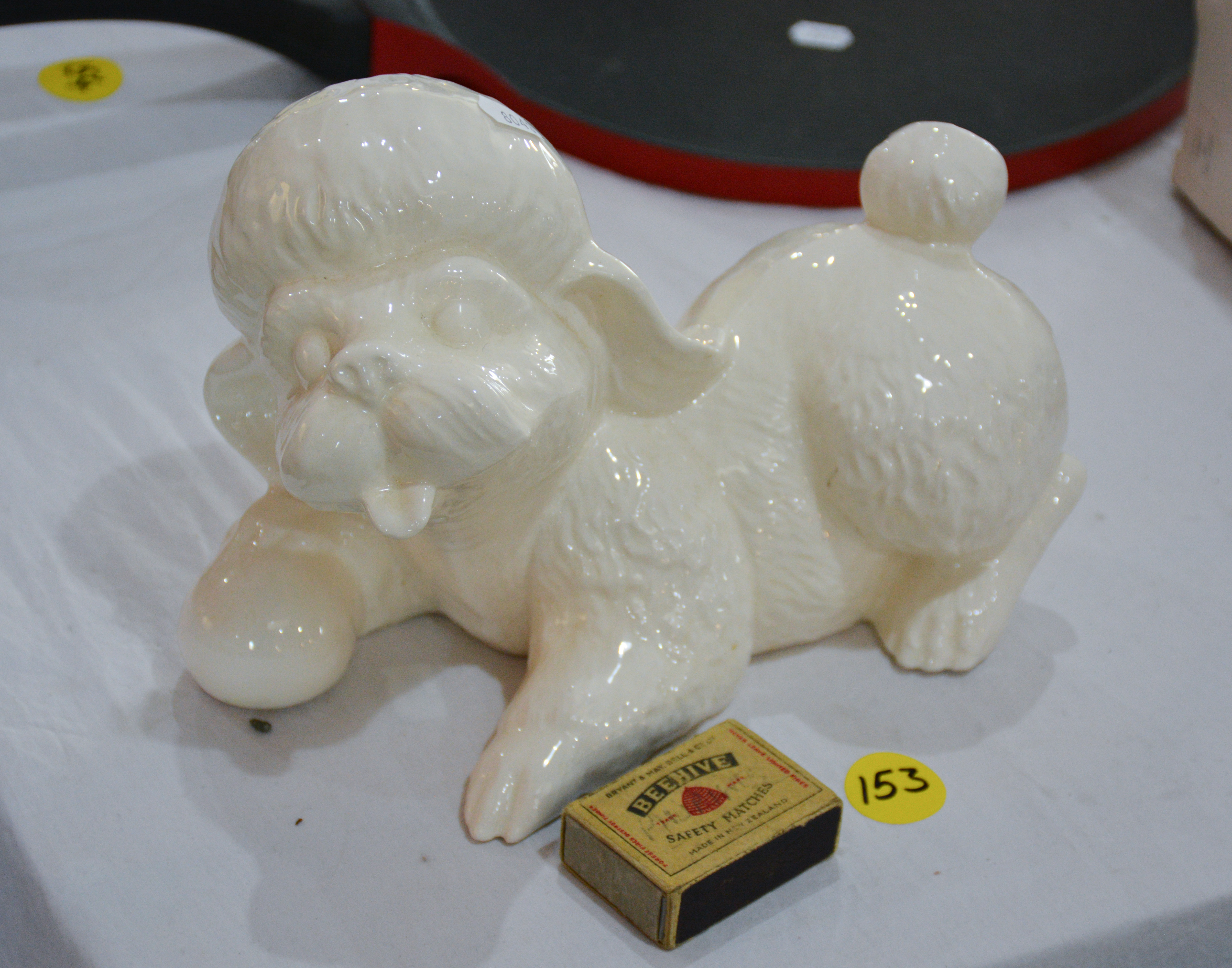 Ceramic White Dog Ornament — sold at auction in New Zealand for $10