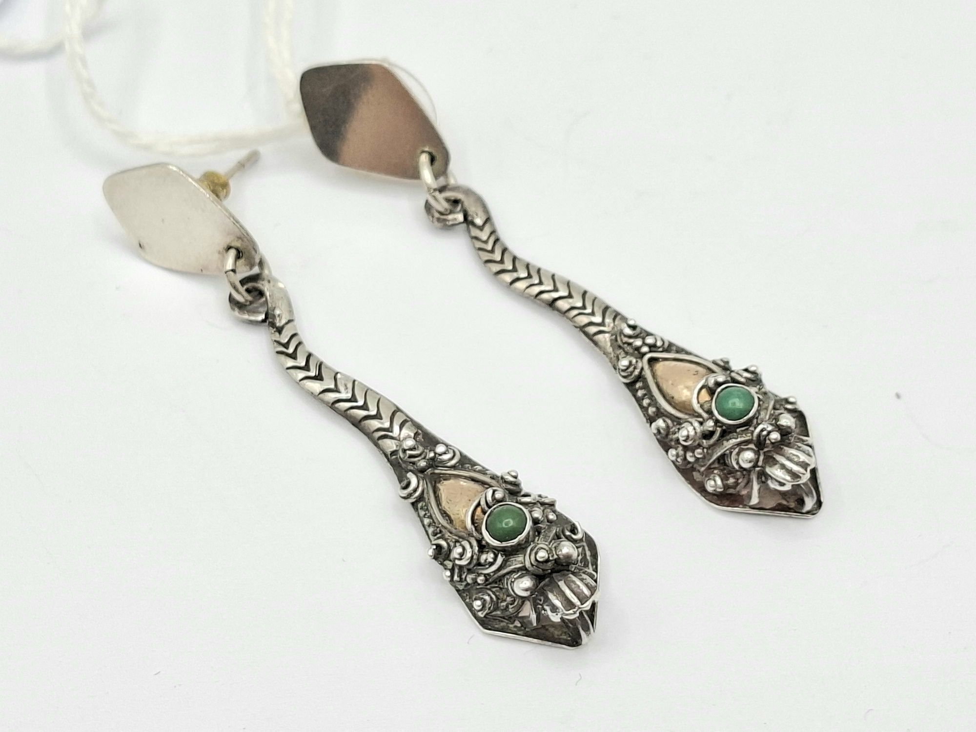 A Pair Of Silver Drop Earrings