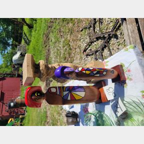 Wood ethnic figurines and partially carved cowboy