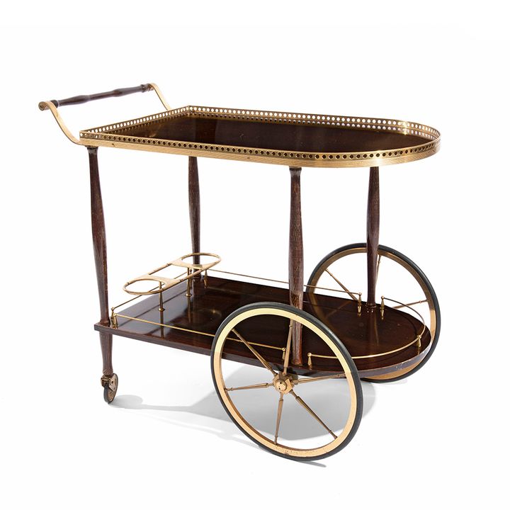 A 1950's mahogany and brass two-tier cocktail trolley
