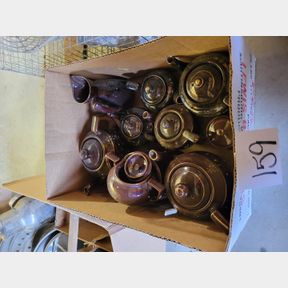 Collection of brown teapots and creamer and sugar