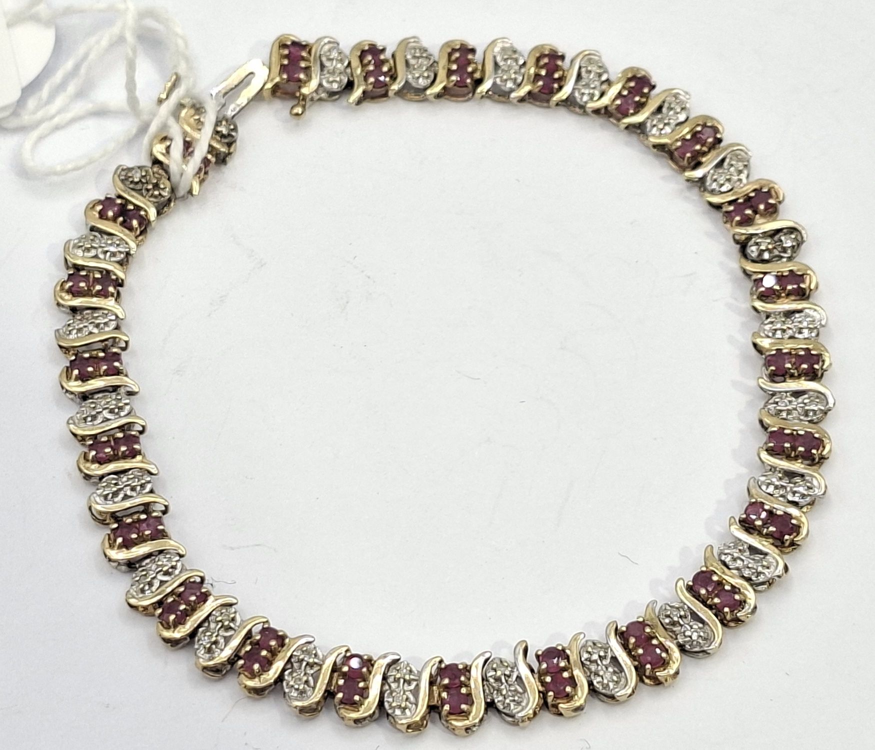 232 · 9CT GOLD RUBY AND DIAMOND BRACELET