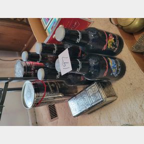 large Budweiser bottles and whiskey containers