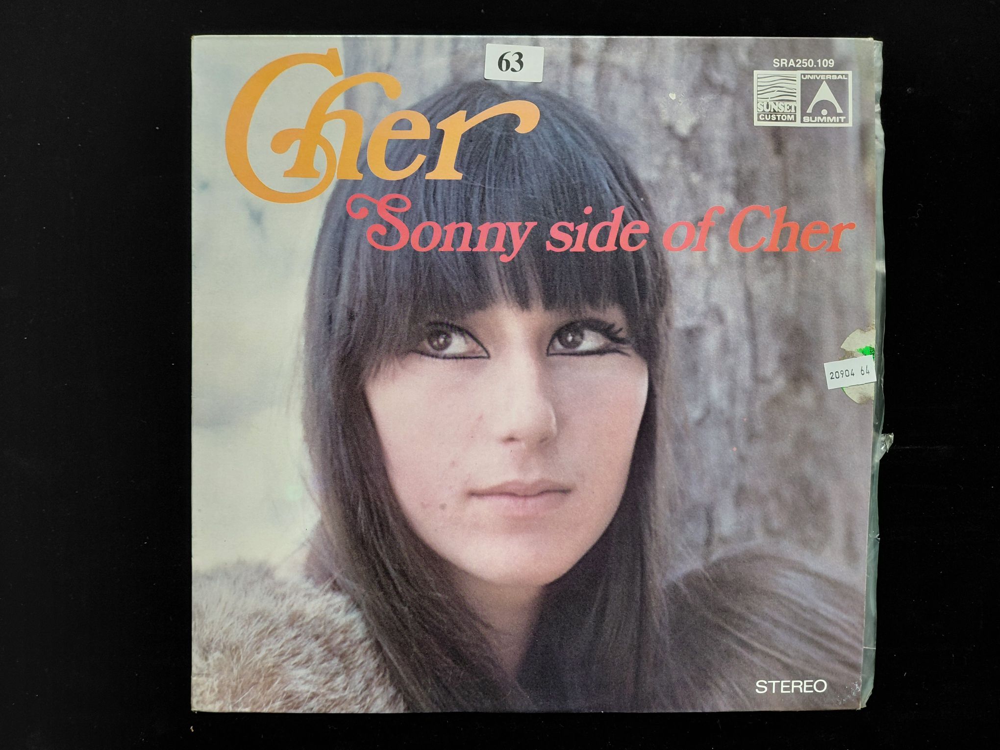 63 · CHER