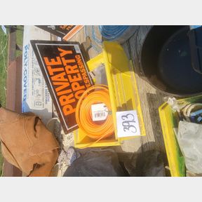 Plastic file box of trimmer cord, trespassing signs and other good hardware