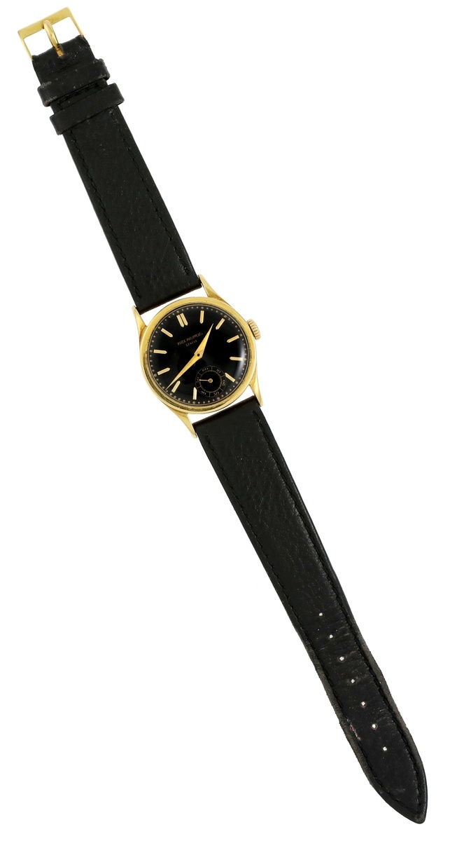 Patek Philippe & Co. Gentleman's Wristwatch. Gold, black face; smaller ...
