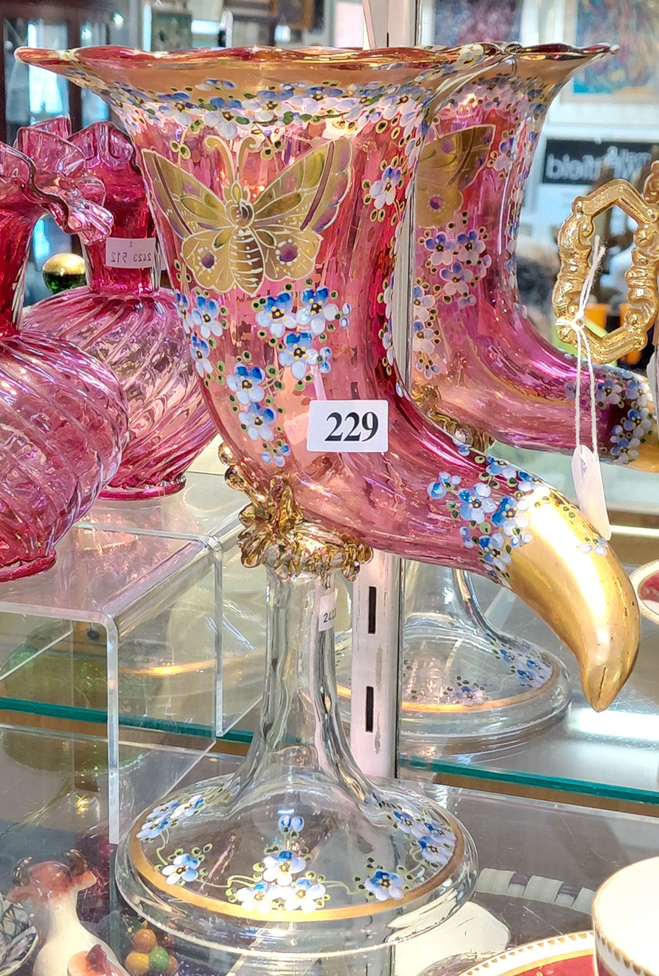 229 · RUBY GLASS CORNUCOPIA VASE