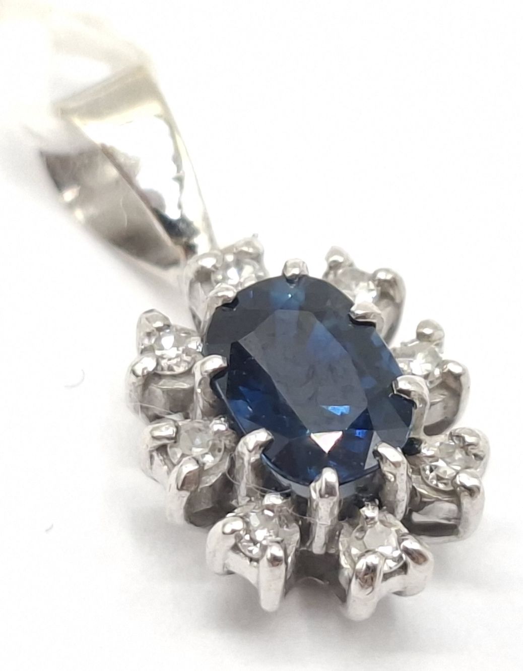 1143 · 18CT SAPPHIRE AND DIAMOND PENDANT