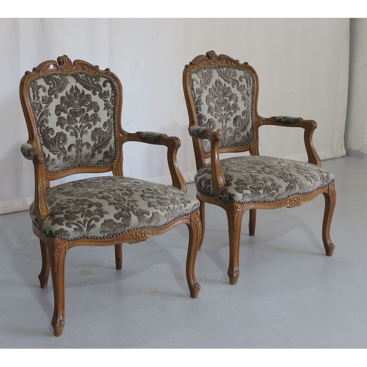 PAIR OF CARVED OAK UPHOLSTERED OPEN ARMCHAIRS