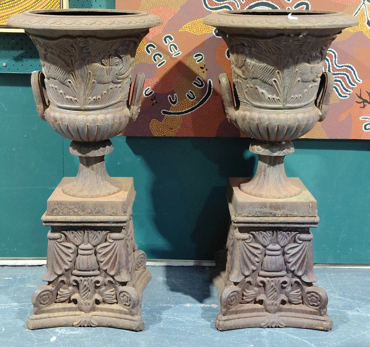 527 · CAST IRON URNS ON STANDS