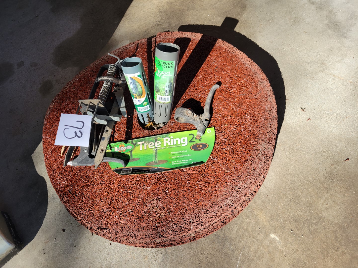 5 tree ring mats, mole trap, other Midwest Auctions, LLC