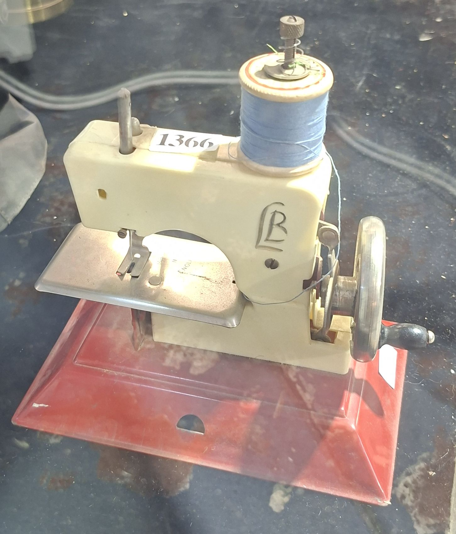 1366 · A TOY SEWING MACHINE