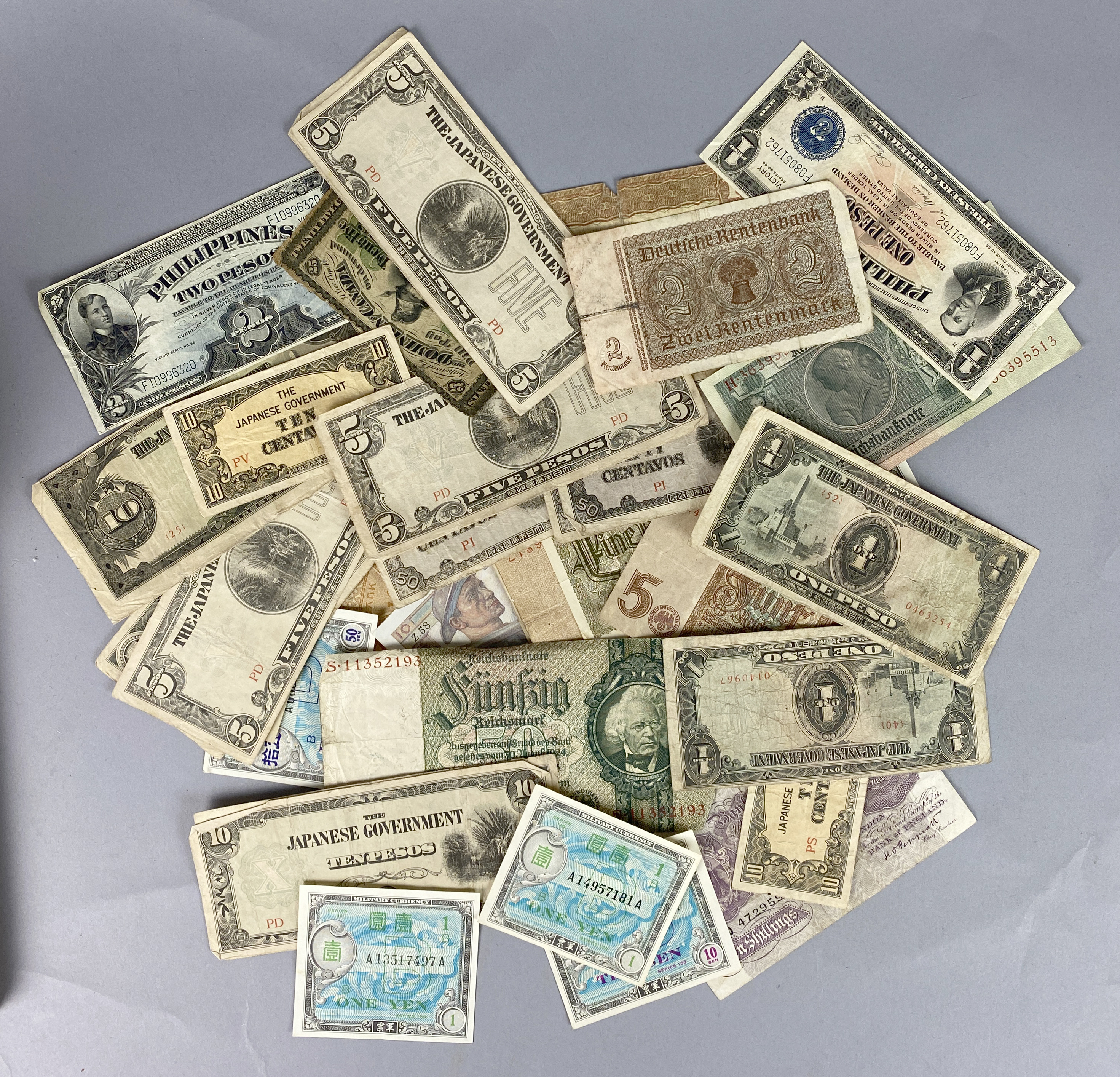 Lot of fifty-one (51) banknotes. Mostly mid-20th century. Fair to UNC ...