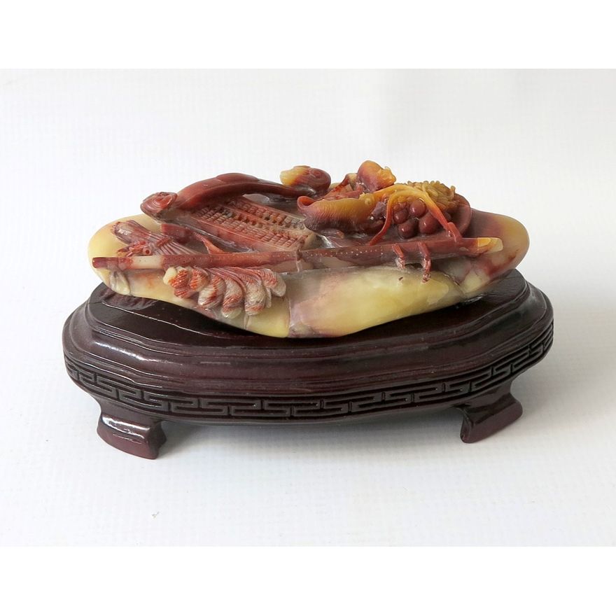 CHINESE CARVED STONE FIGURE ON WOODEN STAND