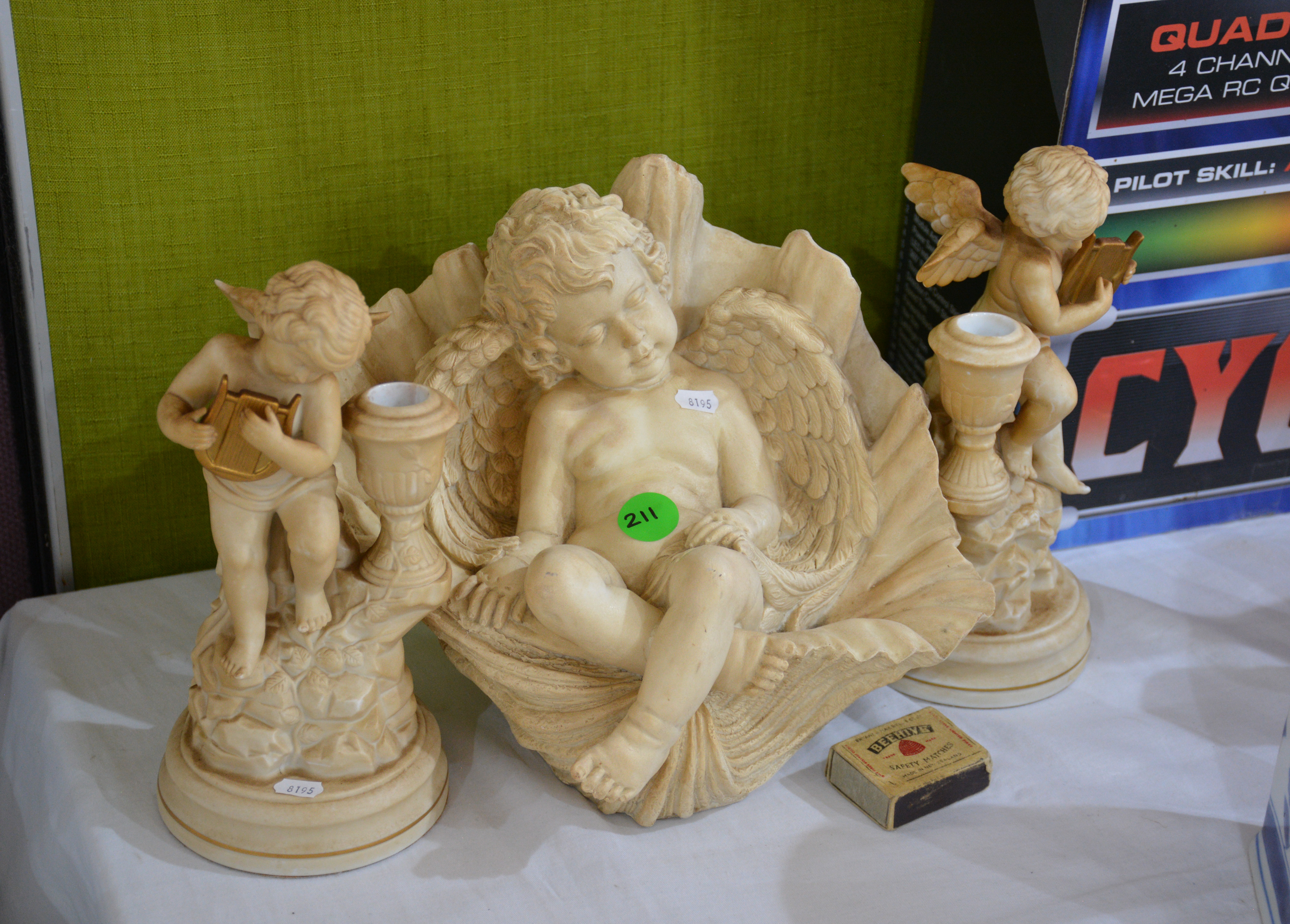 Decorative Cherub Piece and Candlesticks x 2 — sold at auction in New Zealand for $30