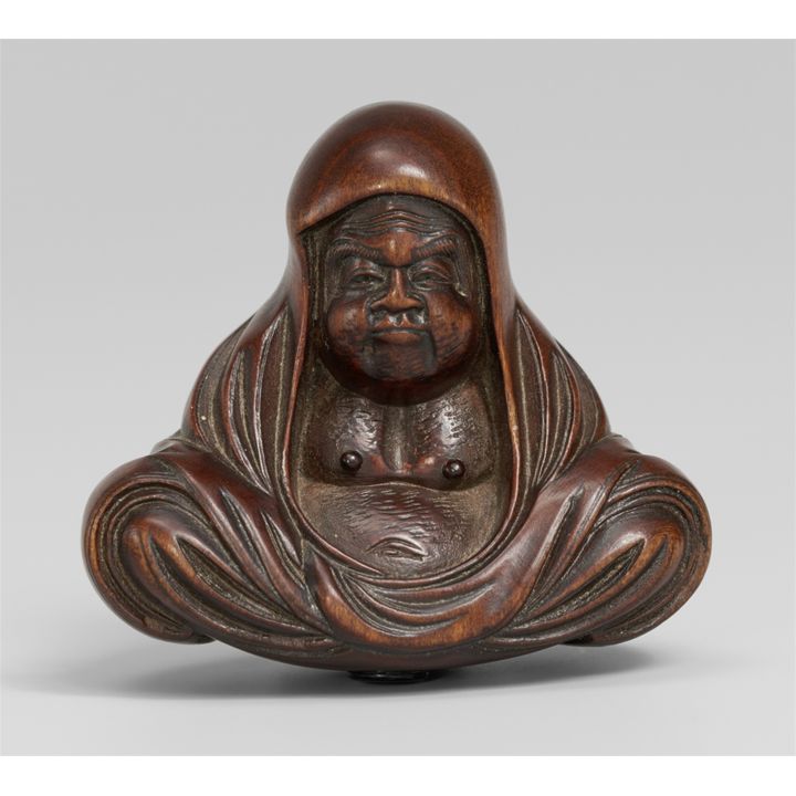A boxwood netsuke of Daruma. Mid-19th century