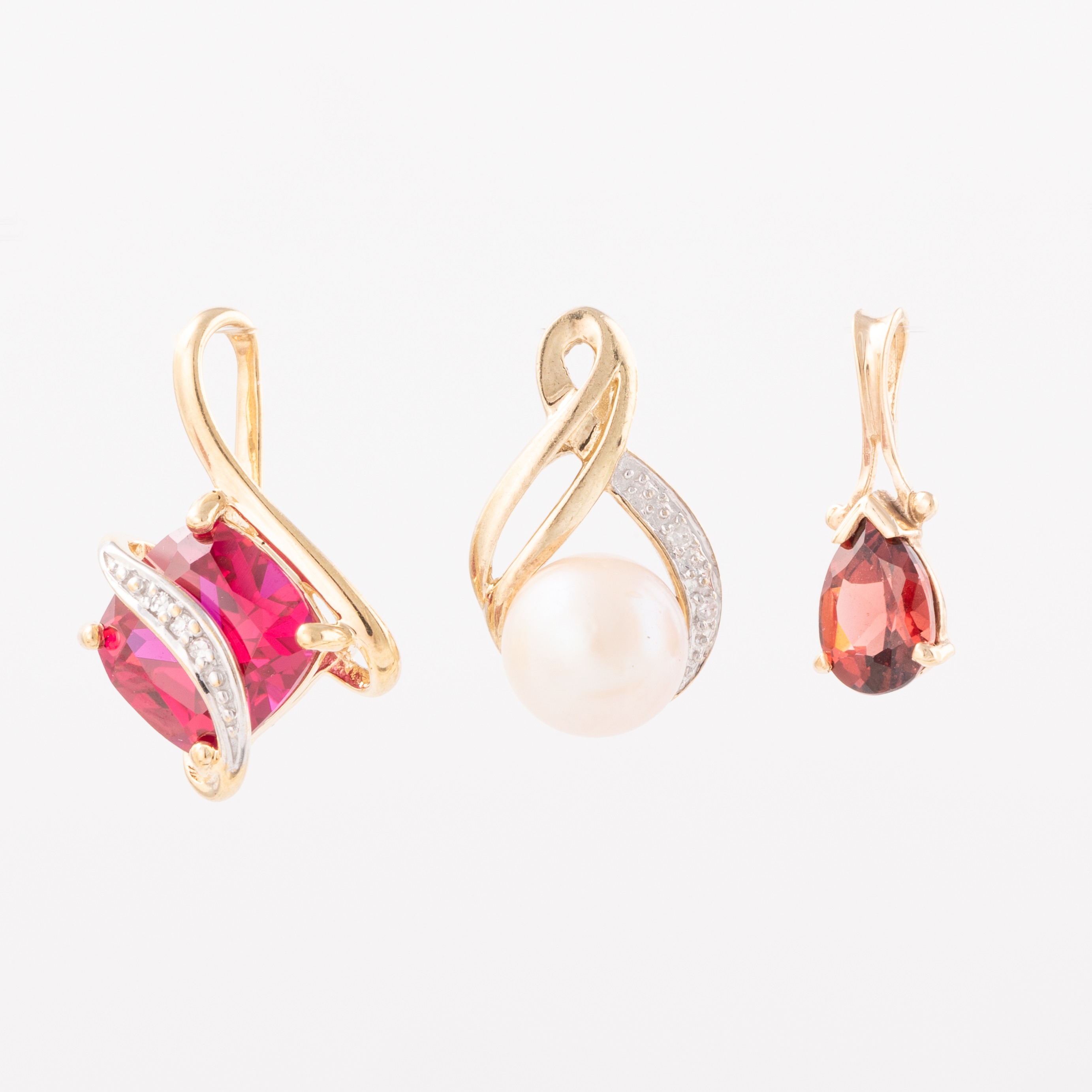 Three 9ct Gold Pendants