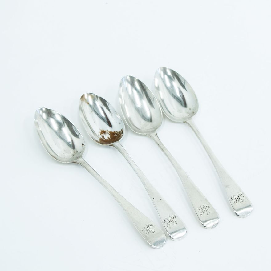 Four Georgian silver Old English serving spoons