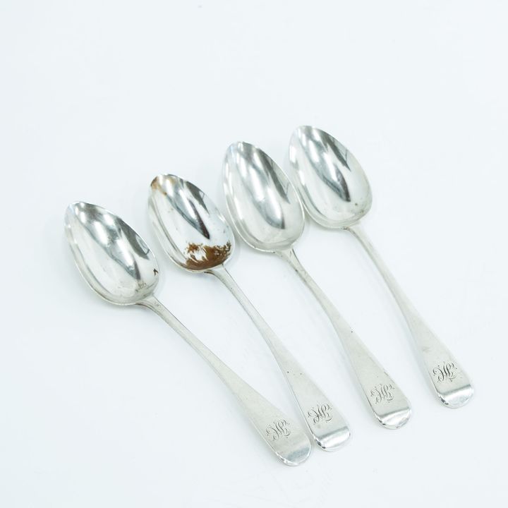 Four Georgian silver Old English serving spoons