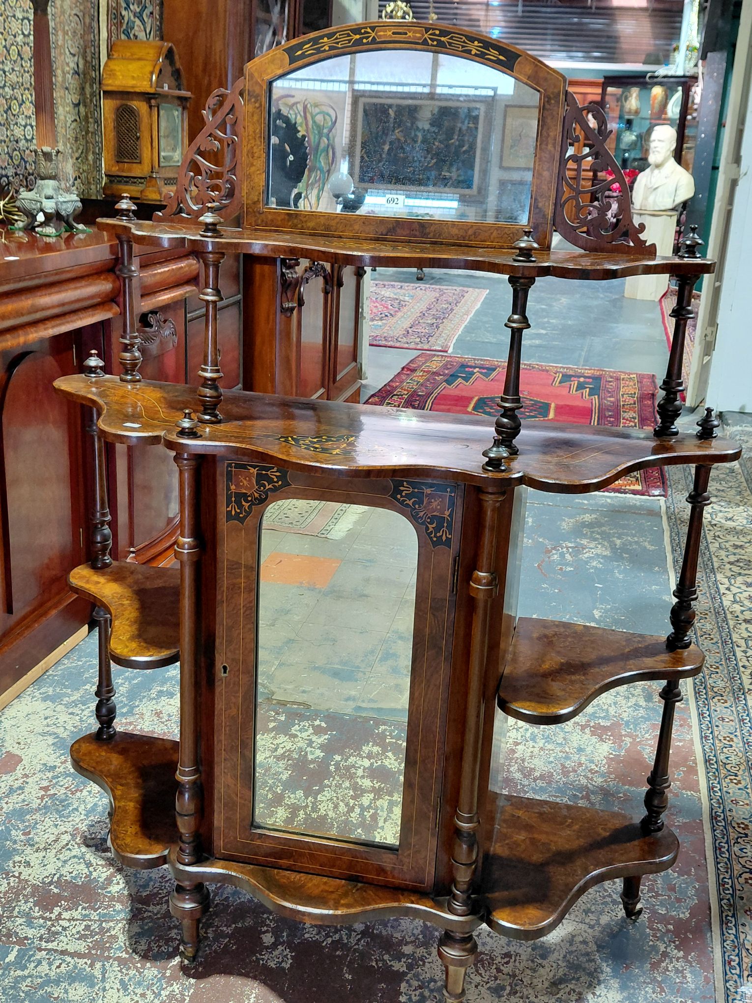A VICTORIAN FIGURED WALNUT CANTERBURY