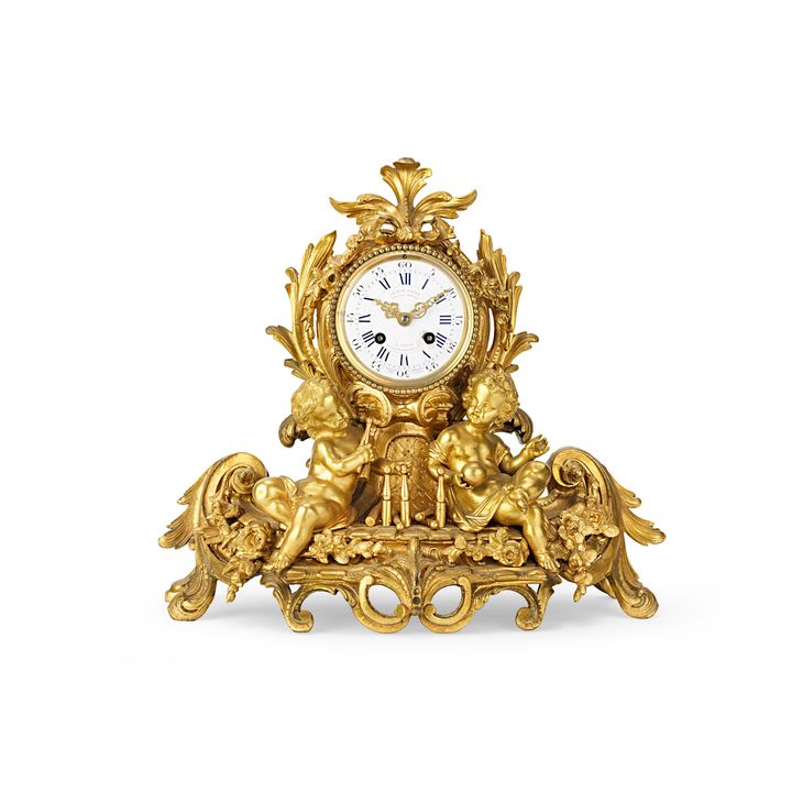 A mid-19th century French Louis XV style gilt bronze mantel clock by Le Roy & Fils