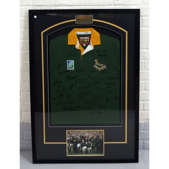 FRAMED 1995 SPRINGBOK WORLD CUP JERSEY, signed by Mandela, Christie and the team