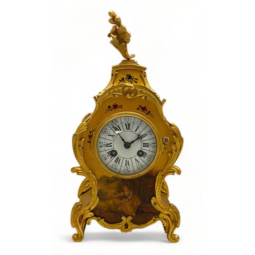 An early 20th century French Louis XV style yellow vernis martin mantel clock