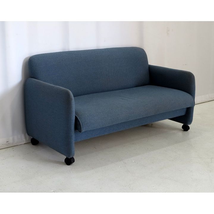 SMALL UPHOLSTERED SOFA ON CASTORS