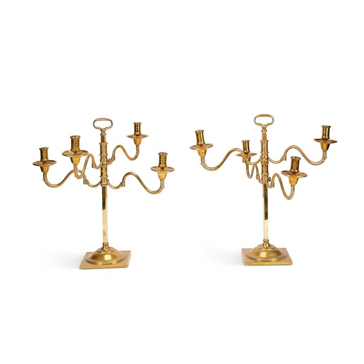 A large pair of Victorian articulated brass four-light candleabra