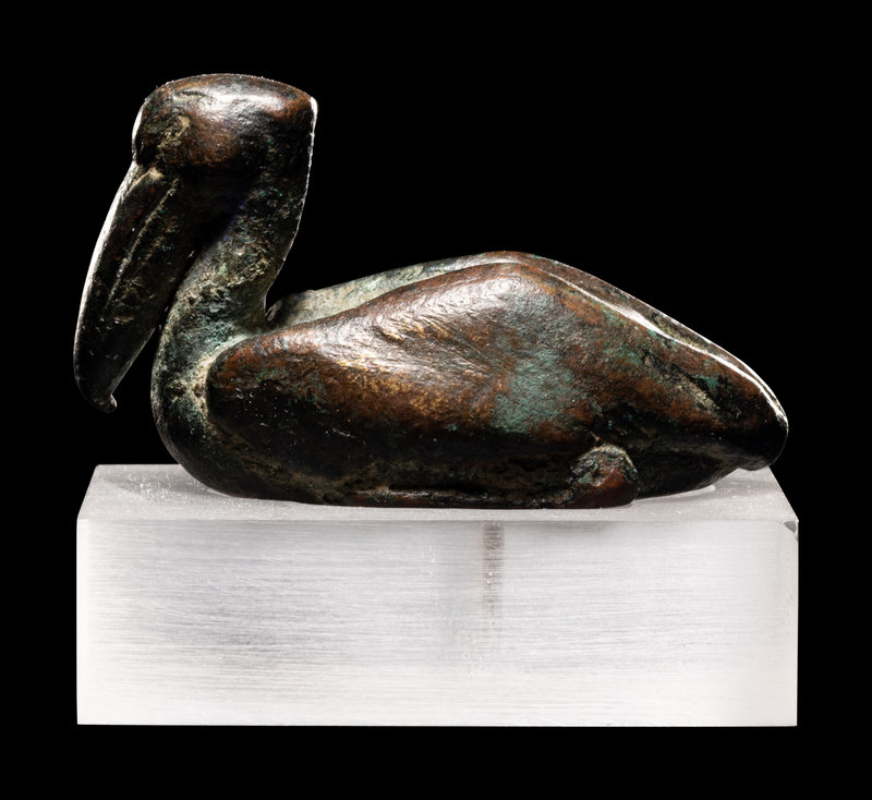 An Egyptian Bronze Deben Weight
Length 2 inches (6 cm).
