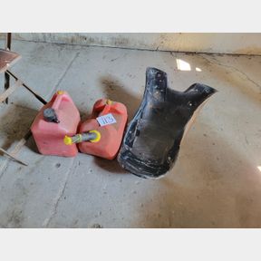 Pair of fuel cans with a bonus fiberglass piece