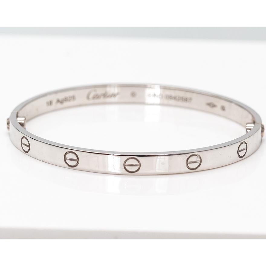 CARTIER Style silver hinge bangle | OldJW Auctioneers