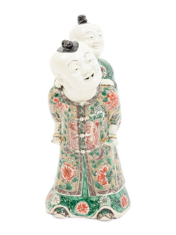 A Chinese Famille Verte Biscuit Porcelain 'Piggyback' Group
Height 9 1/4 in., 23.5 cm.