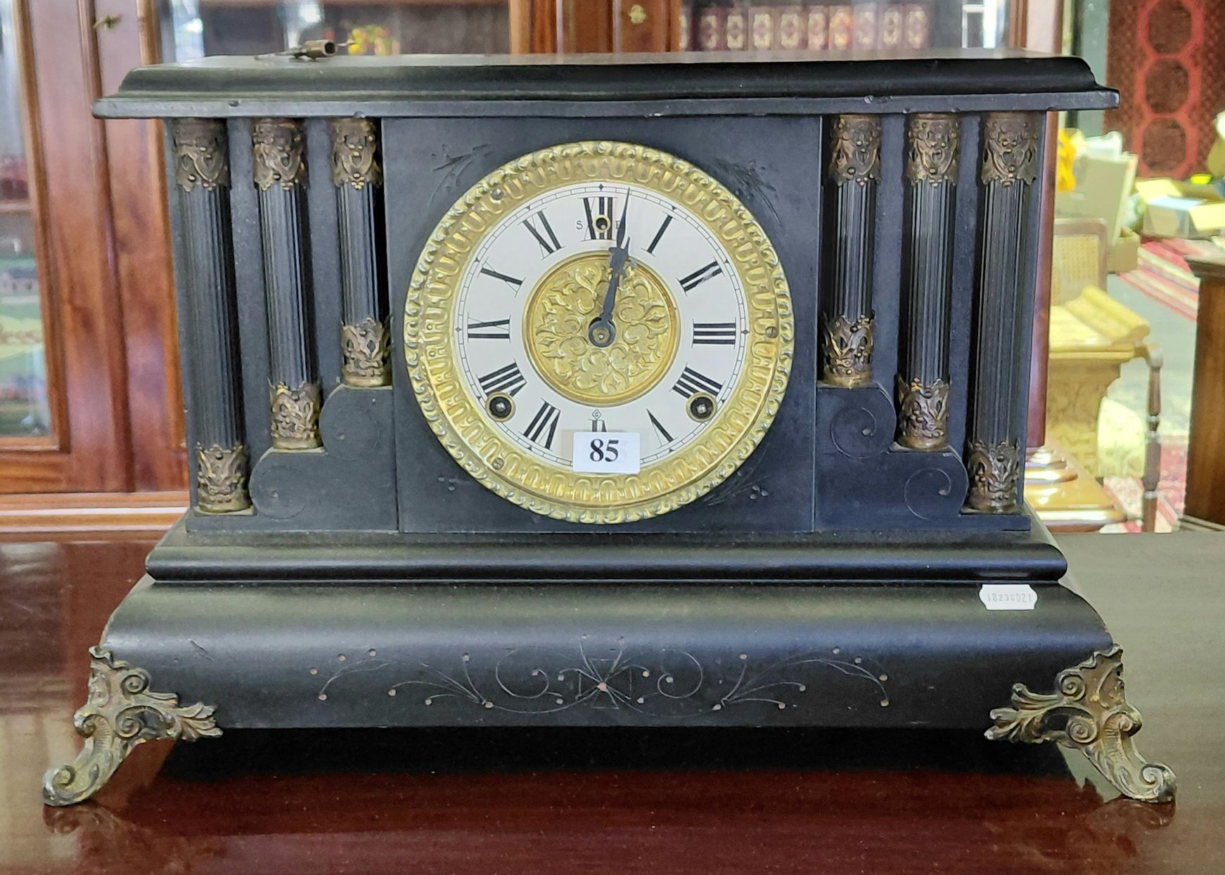 85 · EBONISED WOODEN MANTLE CLOCK
